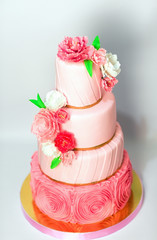 Pink wedding cake isolated on white background. Handmade Wedding