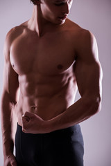 Fototapeta premium close up image of muscular perfect male torso