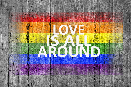 Love is all around and LGBT flag painted on background texture g