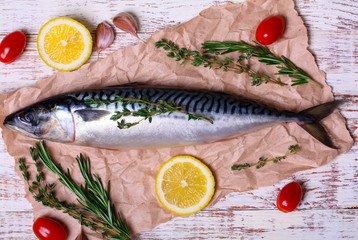 ingredients for baking scomber fillets, include raw mackerel, lemon, garlic, rosemary