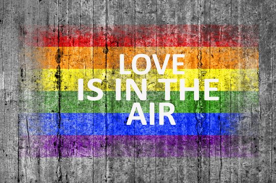 Love is IN THE AIR and LGBT flag painted on background texture g