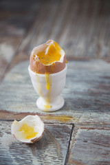 Breakfast with egg and toast on a wooden background