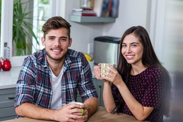 Happy couple having coffee together