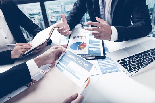 Group of business people busy discussing financial matter during
