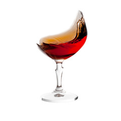 brandy splash in glass without glass isolated on white backgroun
