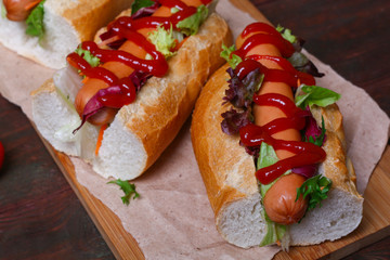 home made Hot dog - sandwich with lettuce on wooden background