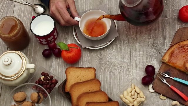 having breakfast with tea and sweets