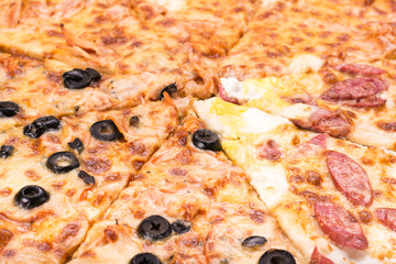 Delicious pizza with ham and vegetables baked in the oven