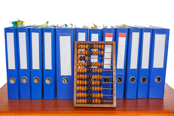 Row of blue office foldersand wooden abacus