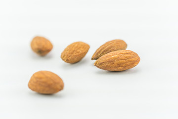 Almonds on a white background - close up of almond 