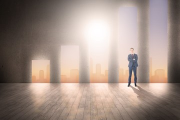 Composite image of happy businessman looking at camera 