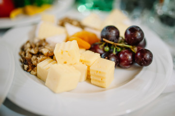 Plate of Cheese with grape at a restaurant
