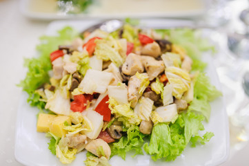 Salad. Table full of food at a restaurant.