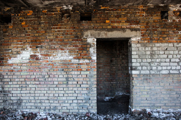 Door aperture inside the old ruined brick building