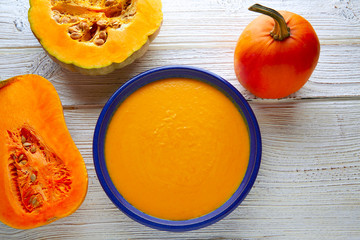 Pumpkin soup cream on wood