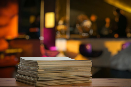 Stack Of Old Magazines On Wooden Table