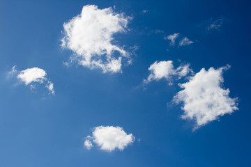 white fluffy clouds in the blue sky
