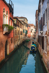 Famous Venetian water canals, historic houses and boats.