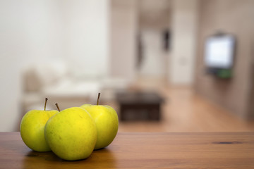 green apples on wooden table