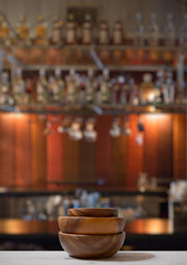 stack of empty wooden bowls on table