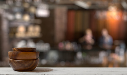 stack of empty wooden bowls on table