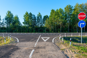 empty country road and crossroad a group signs