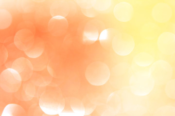 Obraz premium A defocused bokeh of yellow, orange sparkles 