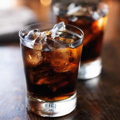 two cold cups of cola soda pop with ice