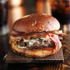 big juicy burger with bacon and melted pepper jack cheese - obrazy, fototapety, plakaty