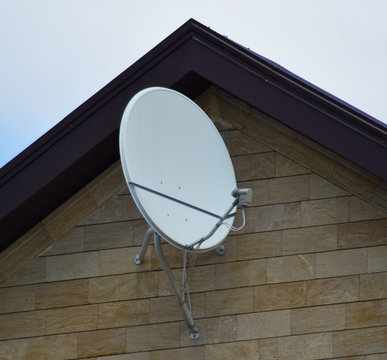 Satellite dish on the front of the house