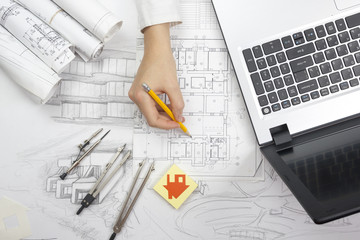 Architect working on blueprint. Architects workplace - architectural project, blueprints, ruler,...