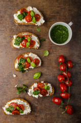 Toasted bruschetta with riccotta and besto