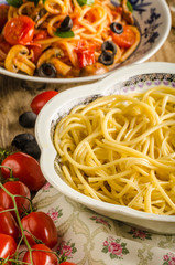Pasta with olives, tomatoes and basil
