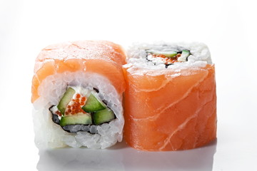 Sushi rolls  with salmon  and caviar on a white background 