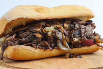 Tasty beef steak onion mushroom sandwich in a ciabatta 