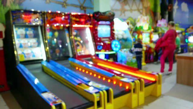Videogames, slots, entertainment center, amusement park, colorful illuminated  with multicolored lights