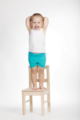 little funny boy on chair