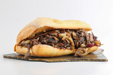 Tasty beef steak onion mushroom sandwich in a ciabatta 
