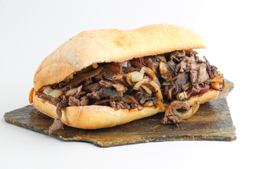Tasty beef steak onion mushroom sandwich in a ciabatta 