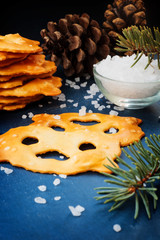 Fresh pretzels with a sea salt on a blue table