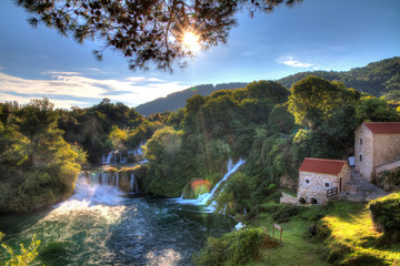 Fototapeta na wymiar Beautiful panorama over a couple of waterfalls of the Krka river in Krka national park in Croatia. HDR