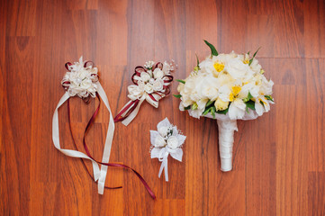 Bridal bouquet of roses on a wooden planks