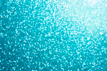 Naklejka na ściany i meble Festive blur blue glitter bokeh background