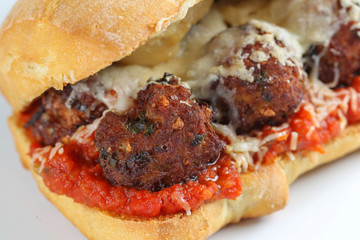 Tasty meatballs sandwich in a ciabatta with tomato sauce and parmesan