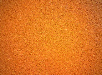 Close up of bright orange wall texture background