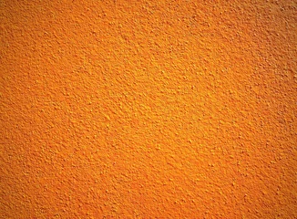 Fotobehang Close up of bright orange wall texture background © wanchanta