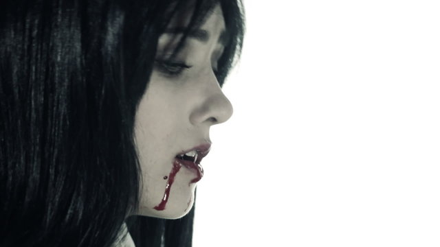 Female vampire in agony dying slowly isolated