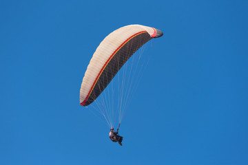 Scenic view of a paraglider on a sunny day.