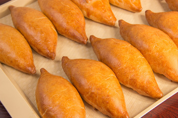 Bakery products. Golden brown cakes, and all Russian belyashi ru