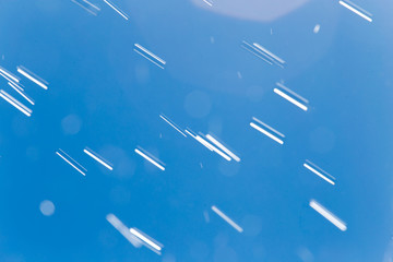rain drops on a background of blue sky